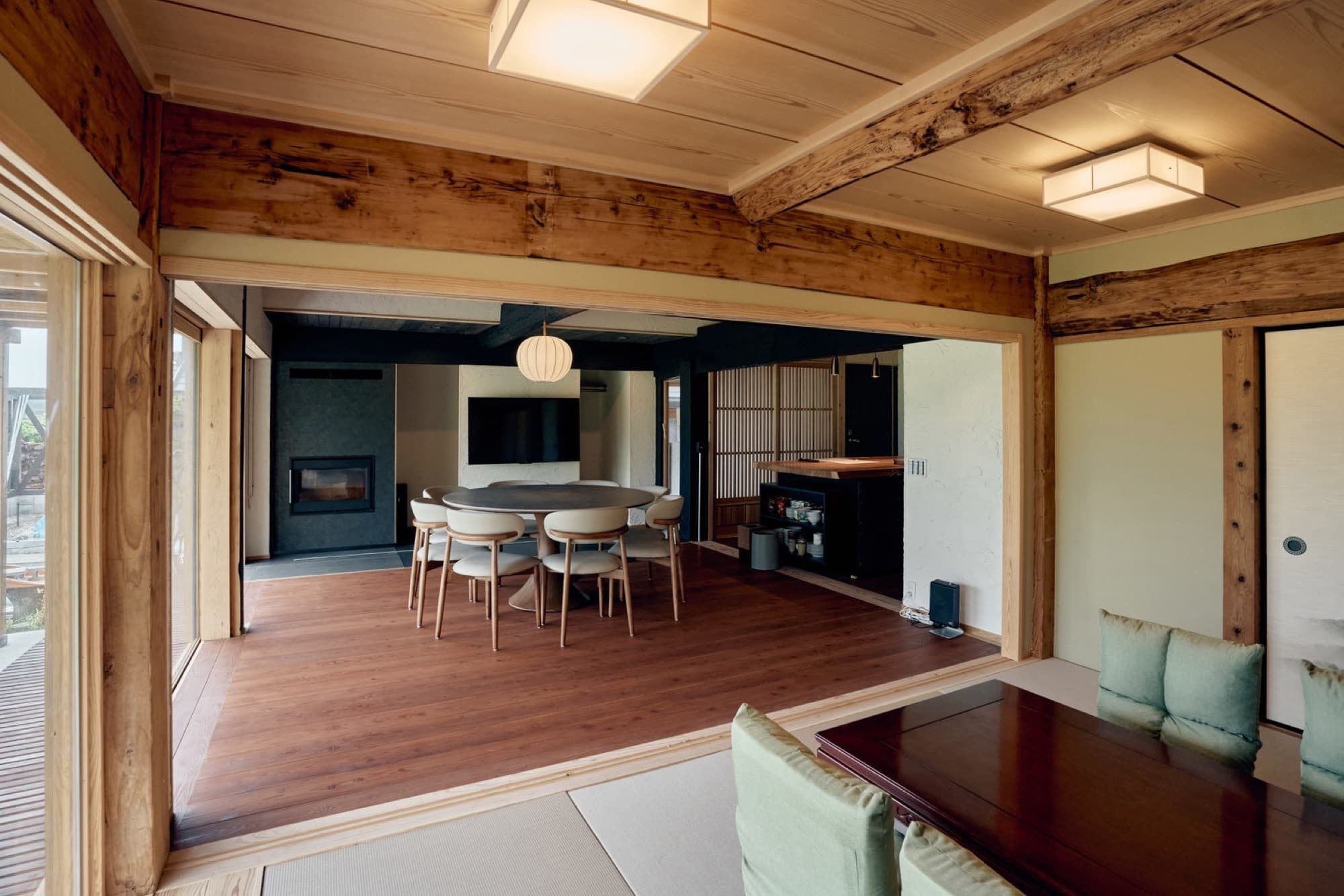 Living and dining space with wood stove and round table